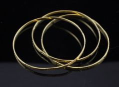 A set of three middle eastern 21ct gold bangles, with bright cut decoration, maker, MB, 25.9 grams.