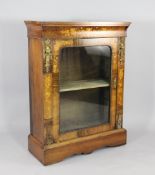 A Victorian walnut and inlaid pier cabinet, with gilt mounts and single glass door, W.2ft 7in. H.3ft