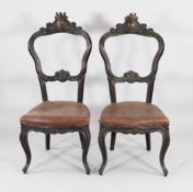 A set of four Victorian mahogany occasional chairs, the high backs with a different coat of arms