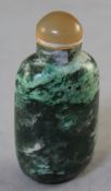 A Chinese green hardstone snuff bottle, with white and apple green inclusions reminiscent of