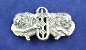 An early 19th century Russian 84 zolotnik silver figural belt buckle, modelled as two crouching