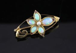 An Edwardian 15ct gold, white opal, ruby and pearl set brooch, of floral design, 1.5in.