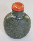 A Chinese snakeskin jasper snuff bottle, 5.8cm., stopper