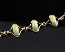 A 1970`s 9ct gold and banded agate bracelet and pair of matching earrings, with shaped oval links,