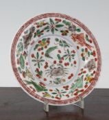 A Chinese famille verte fluted saucer dish, Kangxi period, painted with fish and crustaceans amid