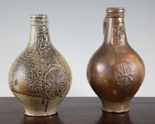 Two German stoneware Bellarmine jugs, 17th century, both moulded with masks to the neck and with