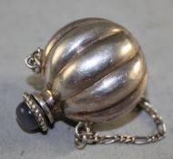 A Chinese white metal melon shaped snuff bottle, with suspension chain and agate mounted stopper,