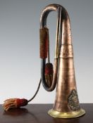 A copper and brass military bugle, mounted a badge with Argyll and Sutherland Regiment, missing