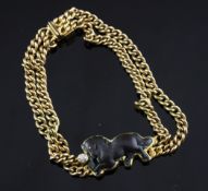 A modern 18ct gold and diamond twin curb link bracelet, with inset bronze model of a horse, gross