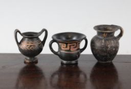 Three Greek black glazed pottery miniature vessels, Southern Italy, c.4th century B.C., comprising