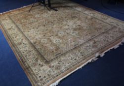 A Persian carpet, with field of scrolling geometric foliate motifs, on a pale mustard ground with