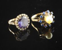 A middle eastern 14ct gold and synthetic corundum dress ring, size H and one other dress ring.