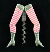 A late 19th century German novelty corkscrew, modelled as a pair of striped stockinged legs, 2.