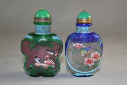 Two Chinese two colour overlaid and enamelled glass snuff bottles, both decorated with birds amid