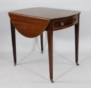 A Regency mahogany and boxwood strung Pembroke table, with bowfront drawer and opposing dummy