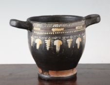 A Gnathian ware black glazed skyphos c.4th century B.C., decorated in coloured slips to one side