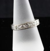 An early 1990`s 18ct white gold six stone diamond set half hoop ring, size Q.