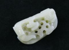 A Chinese pale celadon and russet jade carving, 18th / 19th century, carved and pierced with a chi-