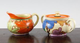 A Clarice Cliff `Umbrellas and Rain` pattern crown shaped jug 5.8in., and a `Blue Autumn` pattern