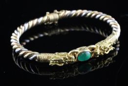 A 20th century Chinese 18ct three colour rope twist gold and cabochon emerald set stiff bracelet,