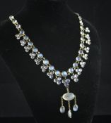 A gold and cabochon moonstone drop fringe necklace, set with eighty seven stones varying sizes, 15.
