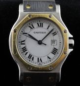 A gentleman`s stainless steel and gold Santos de Cartier automatic wrist watch, with octagonal bezel