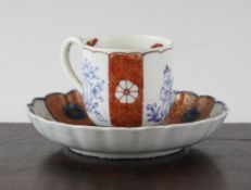 A Worcester Kakiemon style coffee cup, c.1770, with alternating panels of flowers, an oriental