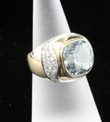 A stylish 18ct gold aquamarine and diamond cocktail ring, size M.