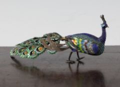 A Chinese white metal and enamel model of peacock, 6.25in.