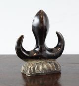 A Chinese biscuit glazed brush rest, early 18th century, in the form of a ridge finial from a