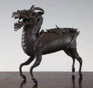 A Chinese bronze `qilin` bronze censer and cover, probably late Ming, in standing pose, with its