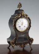 An early 20th century Louis XVI style red boulle mantel clock, with enamelled Roman dial and Japy