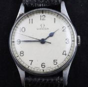 A gentleman`s early 1940`s steel Omega military manual wind wrist watch, with white Arabic dial,