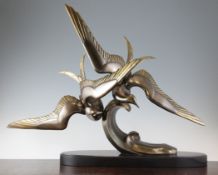 Irenee Rochard (1906-1984). A bronze group of two terns swooping over a wave, on black marble
