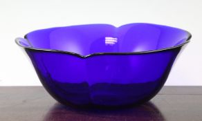 A Chinese blue glass bowl, 19th century, of quatre lobed form, 11in.