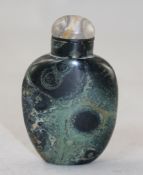 A Chinese green jasper snuff bottle, 6.4cm., stopper