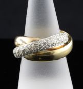 A modern continental 18ct three colour gold and diamond `Russian` wedding ring, with two plain and