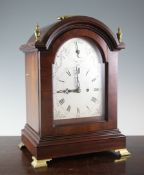An Edwardian Georgian style mahogany chiming bracket clock, with arched case and silvered Roman dial