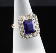 A 1920`s 18ct gold, synthetic sapphire and diamond cluster ring, of octagonal form, size L.