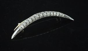 A late 18th century gold, silver and graduated diamond set crescent brooch, 1.5in.