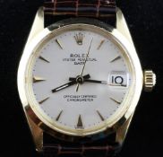A gentleman`s 1950`s 18ct gold mid size Rolex Oyster Perpetual Date wrist watch, with baton numerals