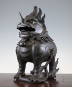 A large Japanese bronze `lion-dog` bronze koro and cover, 19th century, in standing pose, the hinged