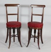 Myles & Edwards. A pair of Victorian mahogany adjustable music chairs, on splayed tapered legs,