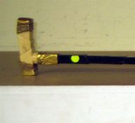 A late 19th century gold plated ivory and ebony walking stick, with sectional handle and cane, 34.