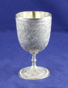 An early 20th century Indian silver goblet, with extensive chased foliate and scroll decoration,