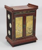 A Japanese shibayama, wood and lacquer table cabinet, the pair of doors decorated with applied birds
