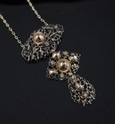 An antique gold, silver and old mine cut diamond drop pendant necklace, of pierced foliate scroll