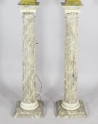 A pair of faux marble fluted ionic pedestals, 3ft 2in.