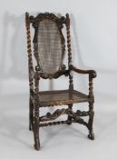 A late 17th century Carolean carved walnut chair, with crowned King Charles crest above a caned back