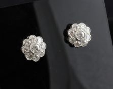 A pair of 18ct white gold diamond cluster ear studs, of flower head design, total weight estimated
